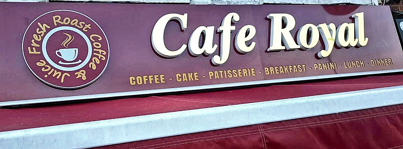 The Cafe Royal signboard above the maroon awning on Plumstead Road