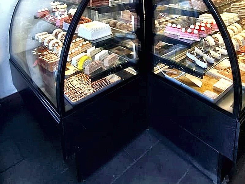 The patisserie cabinets by the door