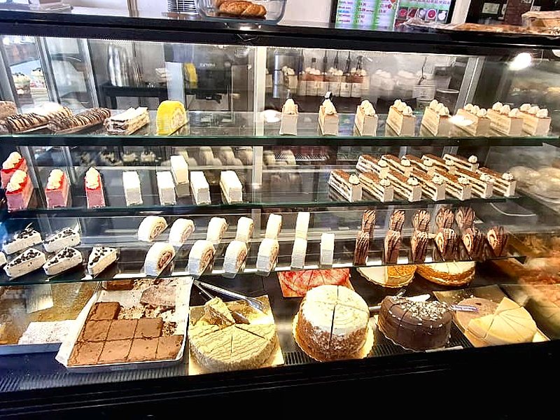 Gateaux and patisserie slices on display