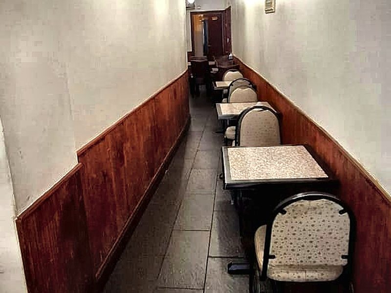 Tables along the walkway inside