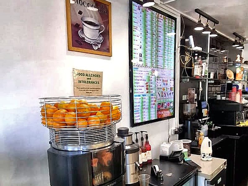 Oranges on the juicer, pressed to order