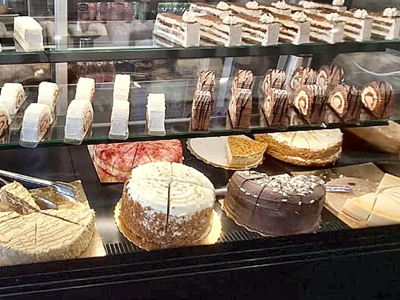 Whole gateaux, a chocolate cake and cheesecake on the Cafe Royal cake counter